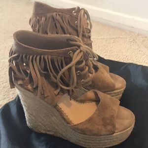 Lace up wedge with trim around the ankles